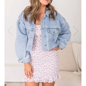 Distressed cropped denim jacket.